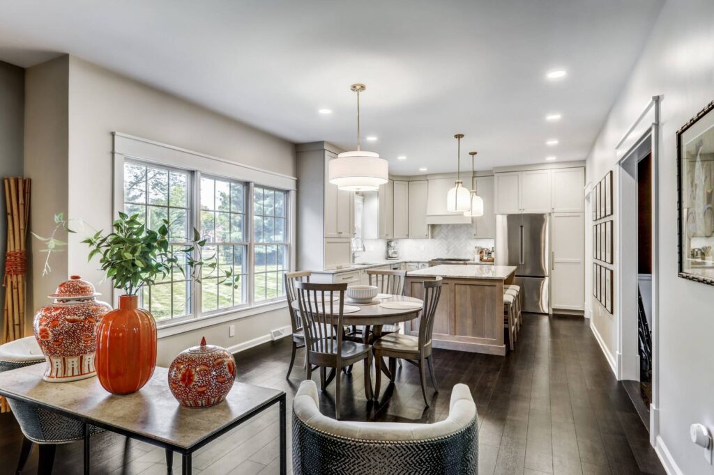 This is a professional photo for a kitchen remodel in Hershey, PA. This includes new lighting, a kitchen island, additional countertop space, tile backsplash, and more.