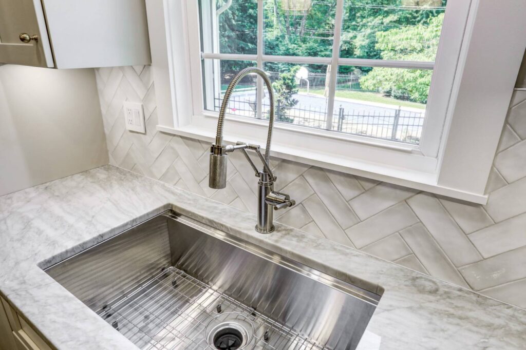 This is a professional photo for a kitchen remodel in Hershey, PA. This includes new lighting, a kitchen island, additional countertop space, and more.