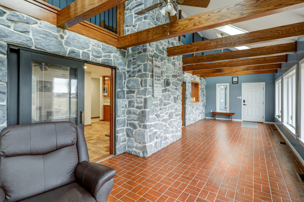 This home includes many interior renovations done with natural woodwork and stone.