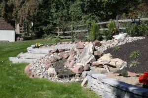 Retaining wall and stone hardscape in exterior renovations project in Lancaster, PA