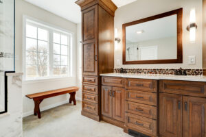 spa-like bathroom design in Lebanon, PA with custom cabinets and a walk-in shower.