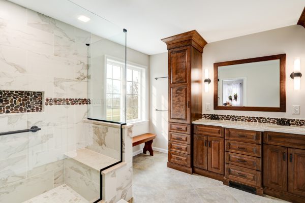 spa-like bathroom design in Lebanon, PA with custom cabinets and a walk-in shower.